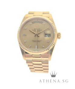 ROLEX 18K YELLOW GOLD OYSTER PERPETUAL DAY-DATE 36MM "9 MILLION" SERIES "CHAMPAGNE BAGUETTE DIAMOND DIAL" (WATCH ONLY) 18038